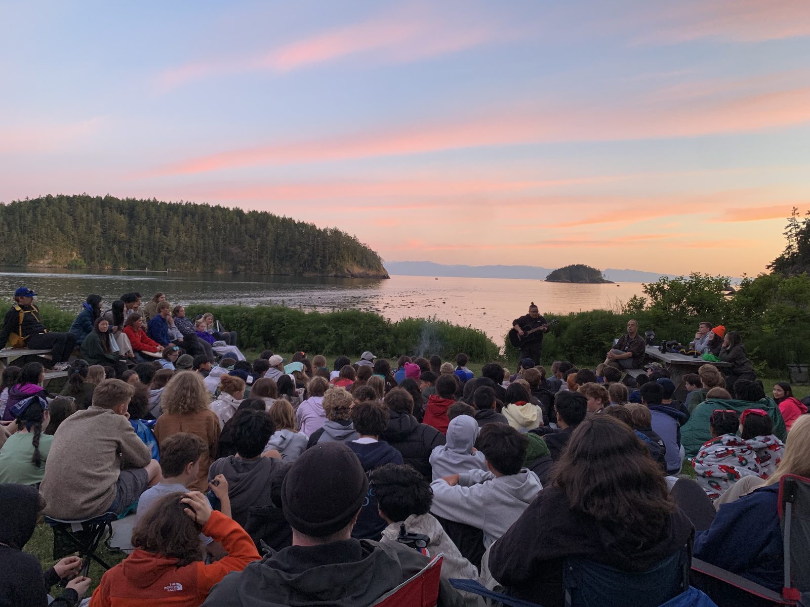 Students watching the sunset together at camp