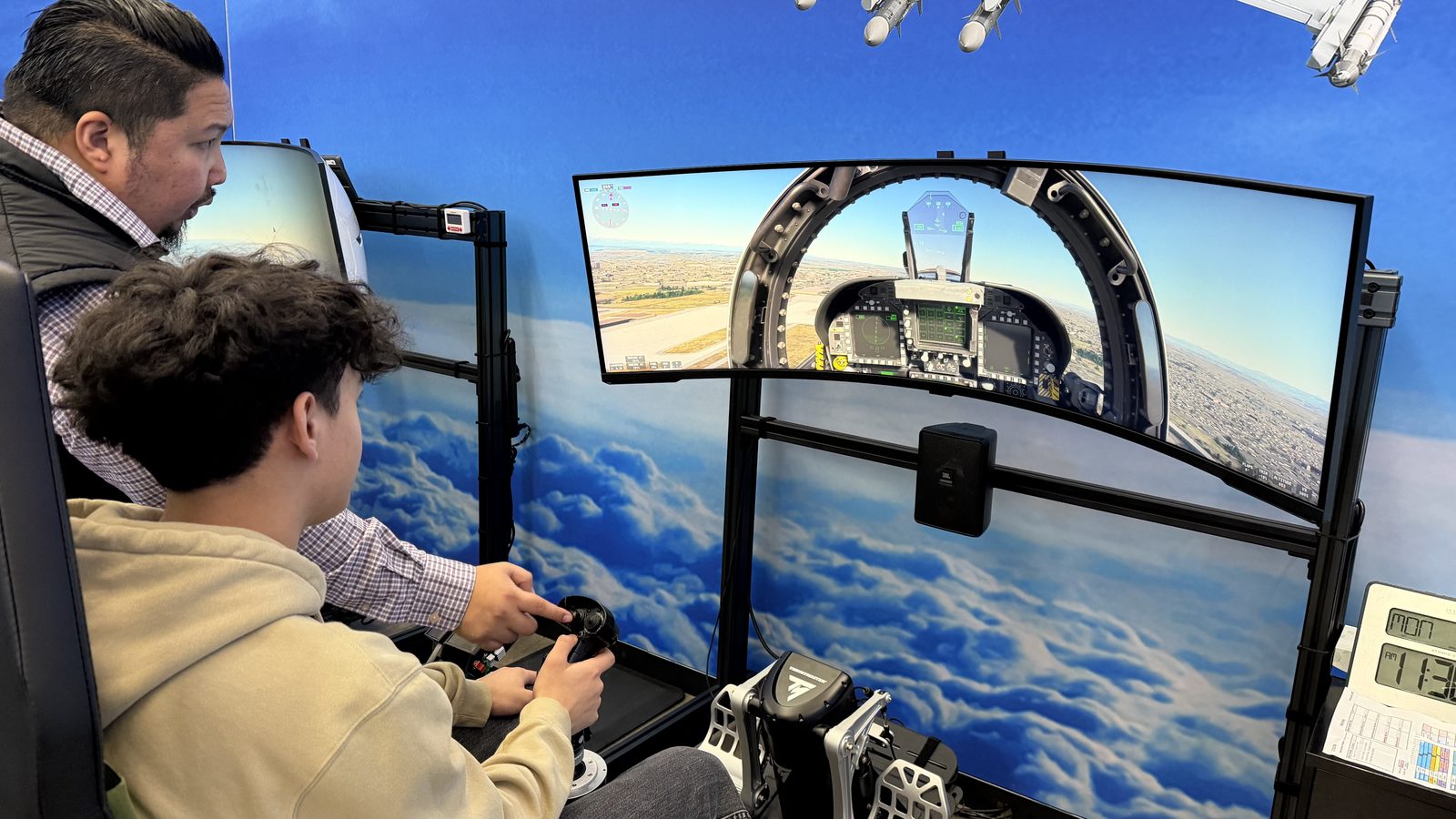A student trying a flight simulator